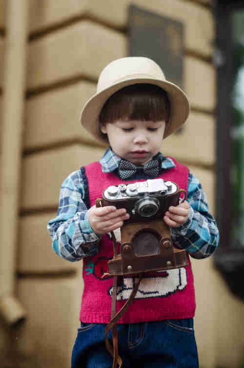 Child Holding Camera