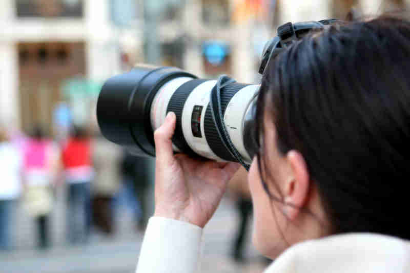 Female Photographer Taking a Photo