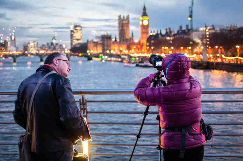 Tourists Taking a Photo of London Skyline using high end camera